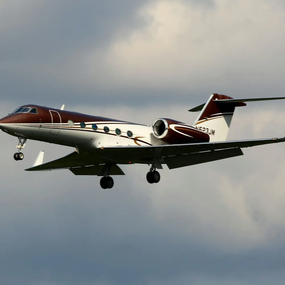 Light jet in flight with gear down