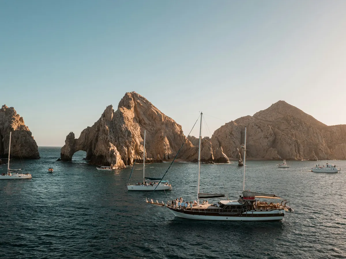 Sailboat anchored near the rock formations of Cabo San Lucas